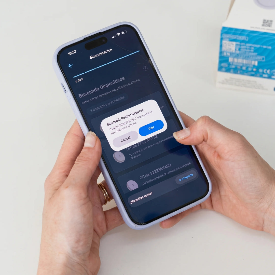 App QiHealth mostrando la pantalla de vinculación Bluetooth con el sensor QiTrax